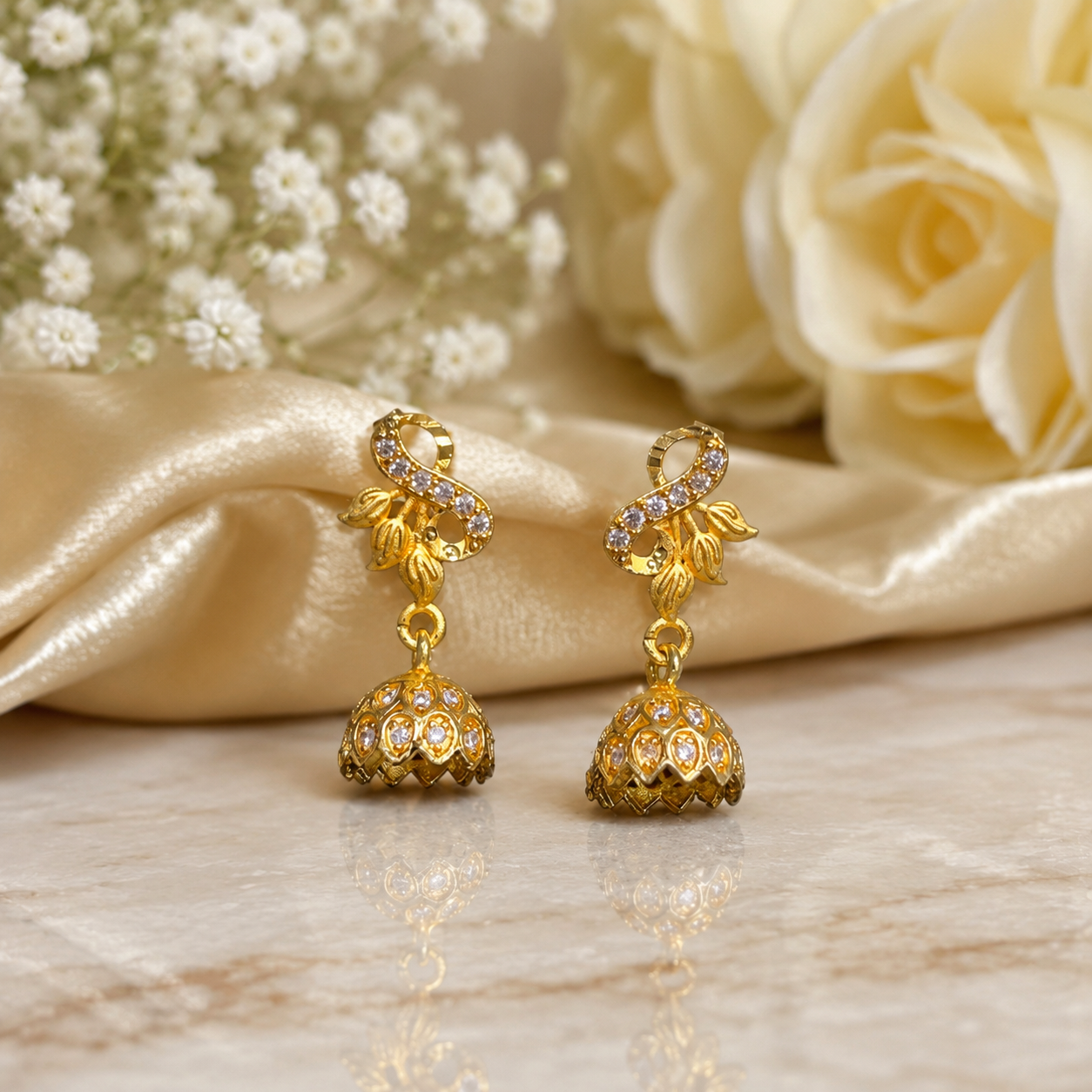 Gold-Plated Infinity Leaf AD Stone Jhumka Earrings for Women