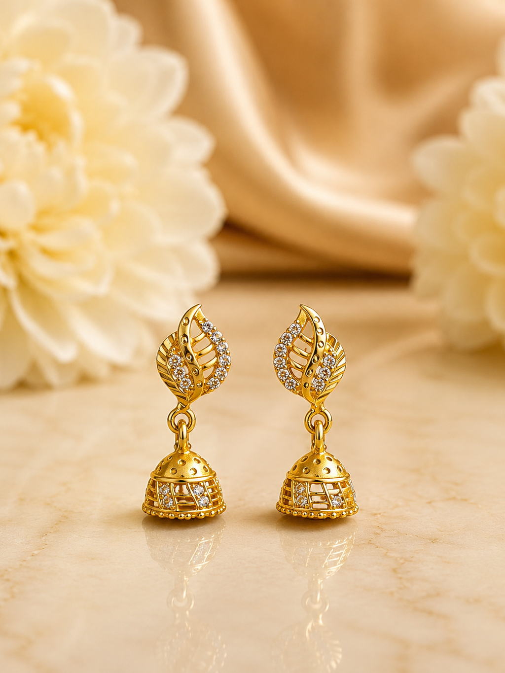 Elegant Leaf Design Gold-Plated Jhumka Earrings with Crystal Stones