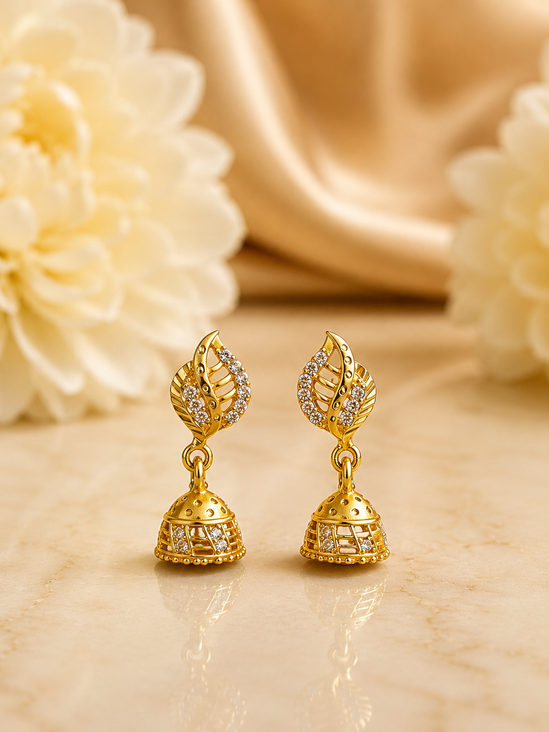 Elegant Leaf Design Gold-Plated Jhumka Earrings with Crystal Stones