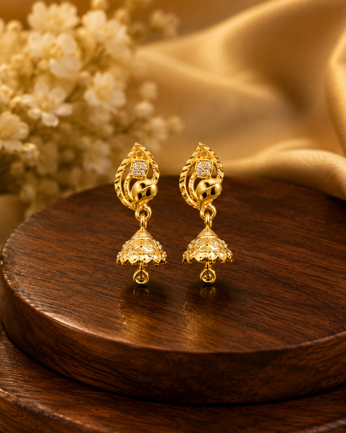 Golden Peacock Leaf Jhumka Earrings with Sparkling Stone Detail