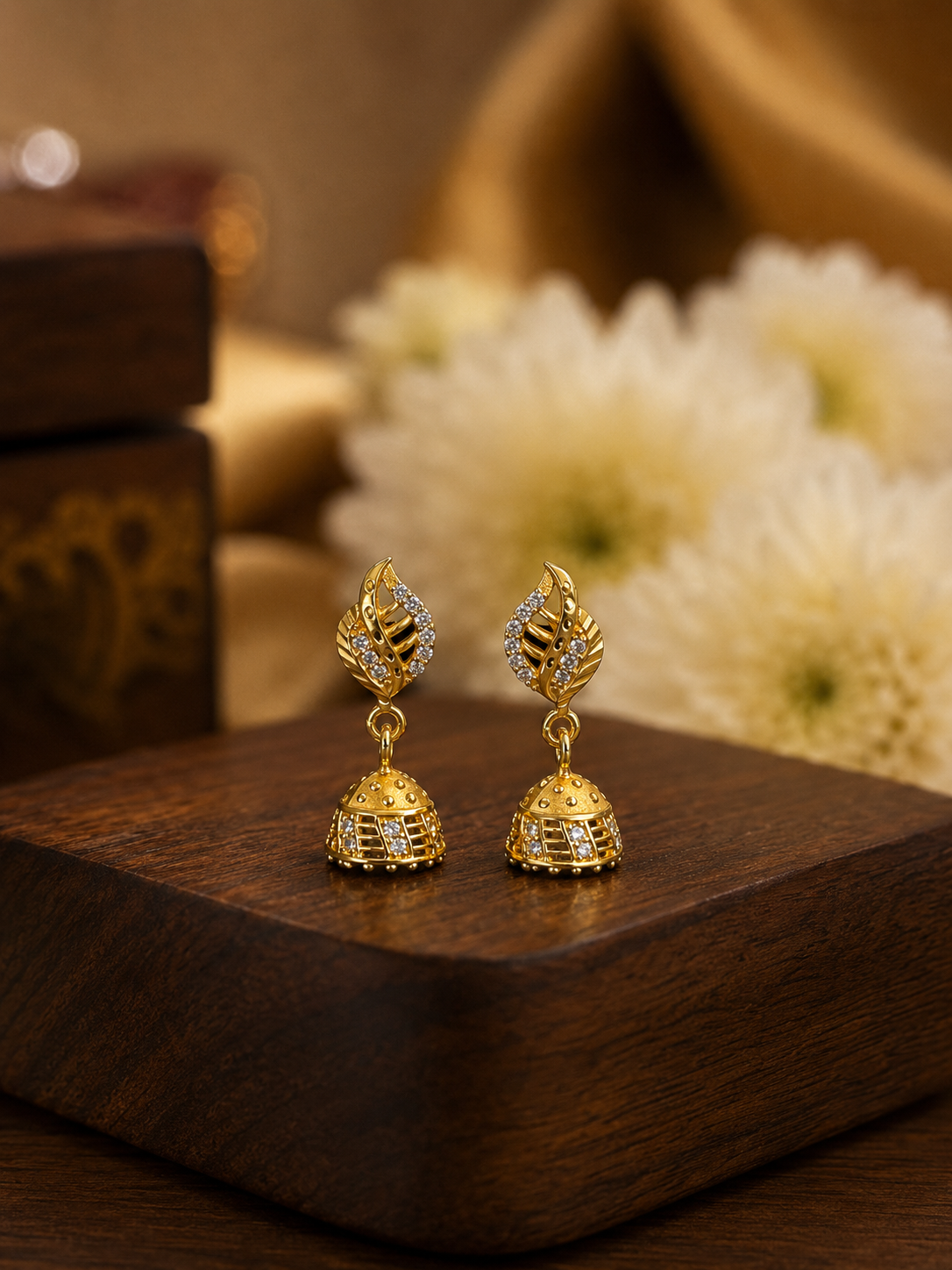 Elegant Leaf Design Gold-Plated Jhumka Earrings with Crystal Stones