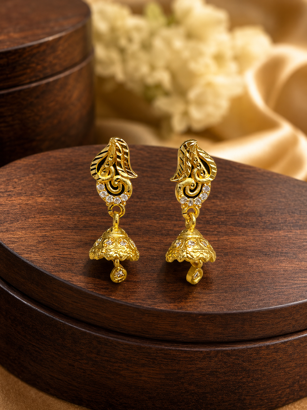 Elegant Gold-Plated Leaf Design Jhumka Earrings with Sparkling Stones